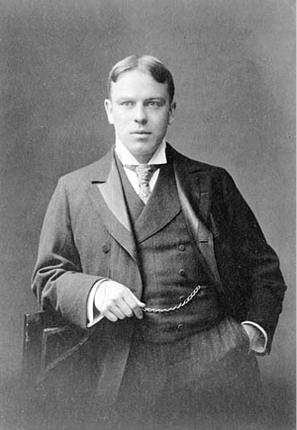 A white male wearing a suit.